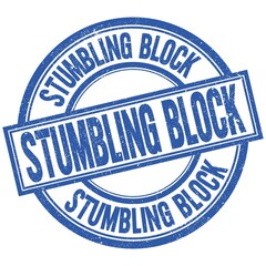 Fototapeta premium STUMBLING BLOCK written word on blue stamp sign