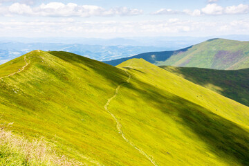 green mountain landscape with rolling hills. spectacular steep slope. beautiful view of borzhava ridge on a sunny day. wide open vista of recreation place in transcarpathia in ukraine