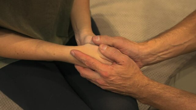 Close-up of hands Man holding woman's hands trying to apologise hoping for forgiveness.