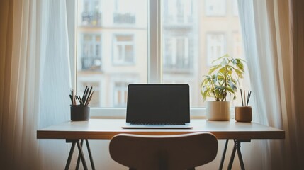 Fototapeta premium Home office laptop workspace window city view