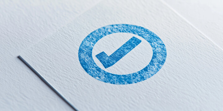 Blue check mark symbol on textured white paper surface representing approval, verification, or completeness in minimalistic design aesthetic