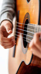 Fototapeta premium Close-up of an older child learning guitar techniques during masterclass