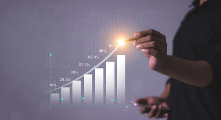 Young man with smartphone mobile hand hold a pen touching to visualize money growth The phone...