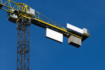 A construction crane with a focus on its branding mockup elements. Isolated blank surface to place your design. 