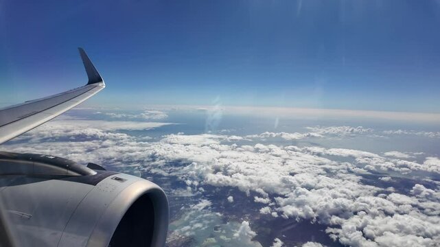airliner airplane flying through clouds -