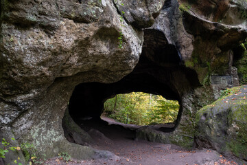 Scenic diversity of Mullerthal, Luxembourg's Little Switzerland, hiking routes, rock formations, moss-covered forests, tourist destination in Europe