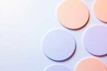 top down view of repeating circular patterns in gradient tones designed for product labels on pristine white surface