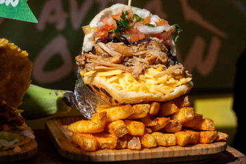 Street food, spicy chicken grilled shawarma or kebab in pita bread on weekly food market in London