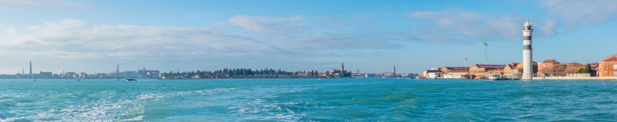 Fototapeta premium Murano Lighthouse and Venice Skyline by the Sea