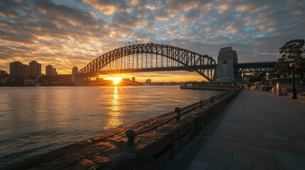 Obraz premium A majestic iron bridge over a wide river at sunrise, with warm hues and no people
