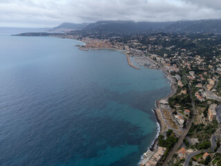 Obraz premium Early morning view on French Riviera, colorful Menton old city and marina on blue Mediterranean Sea near French-Italian border, Monaco, Monte-Carlo, travel destination, panoramic view