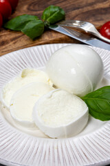 Tasty italian food, fresh white buffalo mozzarella soft cheese balls from Campania close up