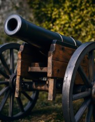 A Historic Cannon: Close-up view of an antique war artillery on a sunny day with a green background