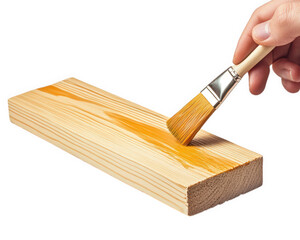 hand holding brush applies varnish to wooden plank, showcasing craftsmanship and attention to detail. This captures essence of woodworking and DIY projects