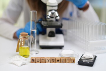 A detailed scientific analysis of butyrates utilized a microscope and several samples for a thorough evaluation process