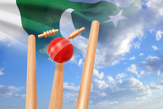 Cricket ball hitting wicket stumps against blue sky with Pakistan flag. 3d-rendering - Powered by Adobe
