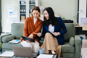 Diverse Business Team Discusses Financial Project Analysis in Meeting.