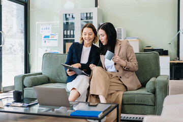 Diverse Business Team Discusses Financial Project Analysis in Meeting.