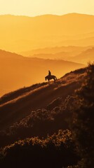 Silhouetted cowboy riding a horse atop a grassy hill during sunset, framed by a stunning mountainous landscape