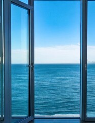 A view of the ocean from a window of a building