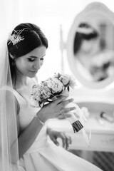 brunette bride in a tight wedding dress in a studio