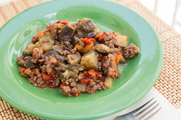 Dish of vegetable stew. stewed eggplant, minced meat, carrots, peppers, onion squid