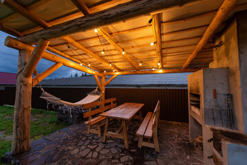 Cozy Outdoor Patio with Hammock and String Lights