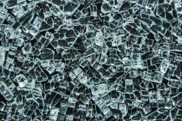 Crushed glass sand texture on black background as background
