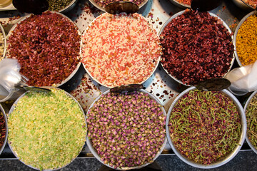 Colorful bins of specialty fruit tea blends in the Mahane Yehuda market in Jerusalem, Israel.