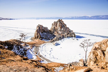 Landscape ice blue deep lake winter clouds Baikal Siberia Russia rock Shamanka