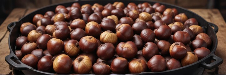 Aromatic chestnuts piled high in a traditional cast iron roasting oven , cast iron roasting oven, roasted nuts, aromatic chestnuts
