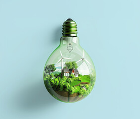 Light bulb miniature landscape wind turbines and cottages, grassy garden. Concept green energy