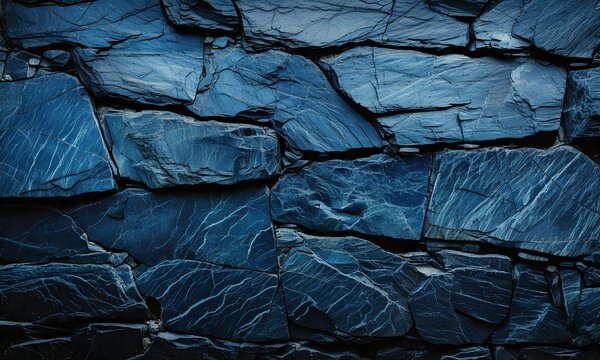 Dark blue slate rock texture background with rough, cracked layers of stone, showcasing rugged, uneven surfaces, natural mineral patterns, deep crevices, and organic details, adding depth, character, 