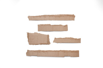 Ripped pieces of cardboard on a white background with copy space