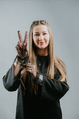 Woman showing dotted gloves with style