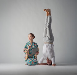 the man stands upside down