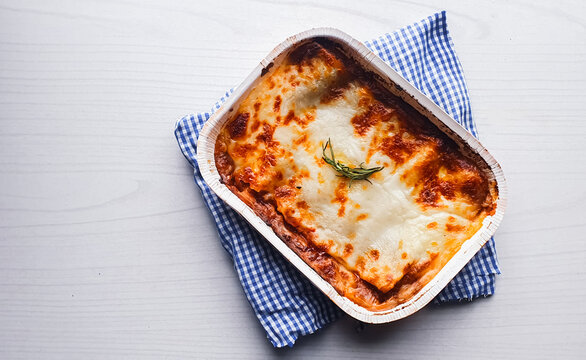 lasagna shaped bolognese seen from above and light background