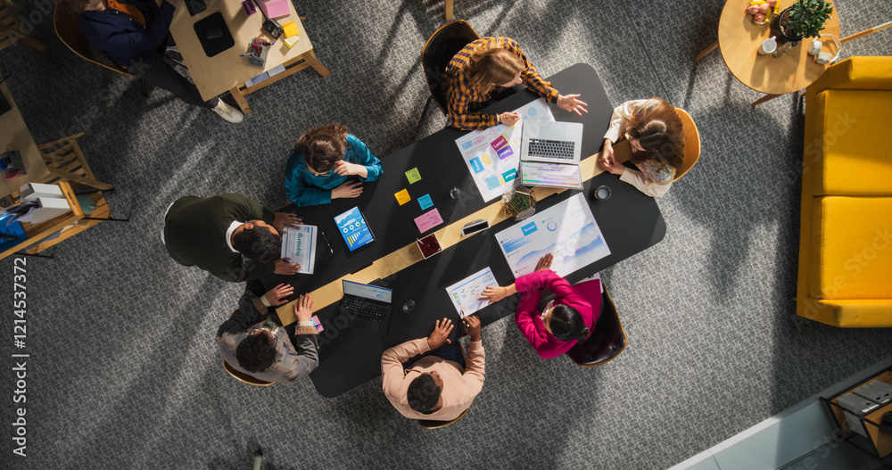 Leinwandbilder Top Down View: Innovative Teamwork at Office Table. Diverse Professionals Collaborate Using Laptops and Tablets, Strategizing and Brainstorming Ideas for Creative Business Problem Solving