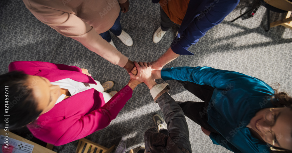 Aufkleber Top Down View of Diverse Team Stacking Hands in an Office, Symbolizing Unity and Teamwork. Professional Managers and Specialists Celebrating A Successful Month of Sales and Revenue Growth