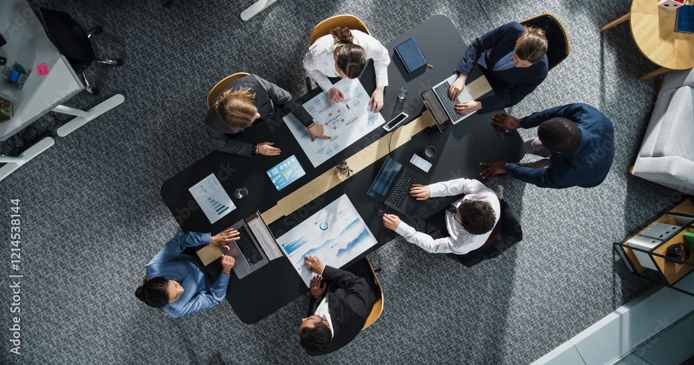 Fototapete diverse professionals working on business statistics reports and marketing plans in an office. top d