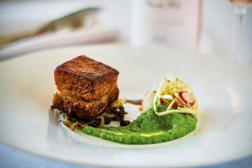 braised pork belly with a pea puree
