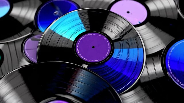 Vinyl records with vibrant blue and purple labels are stacked, forming a captivating backdrop that evokes the nostalgic charm of analog music