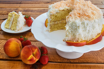 coconut peach layer cake with vanilla icing