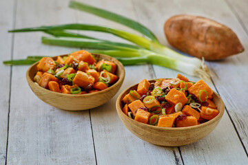 sweet potato salad topped with green onions