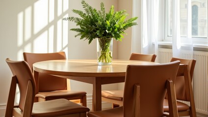 A cozy, polished wooden round table hosts four elegant brown leather chairs, framed by a lush green fern in a crystal vase, radiating warmth and style
