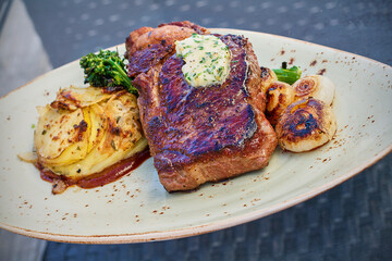 seared ribeye steak topped with an herb butter
