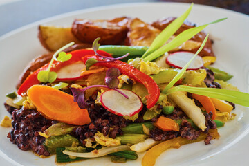 southwest black bean salad on a bed of mixed greens