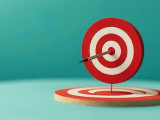 A close-up of a dartboard with a dart hitting the center, symbolizing focus and goal achievement in a business context.