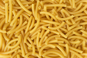 Dry pasta macaroni background. Close up photograph. Top view.  