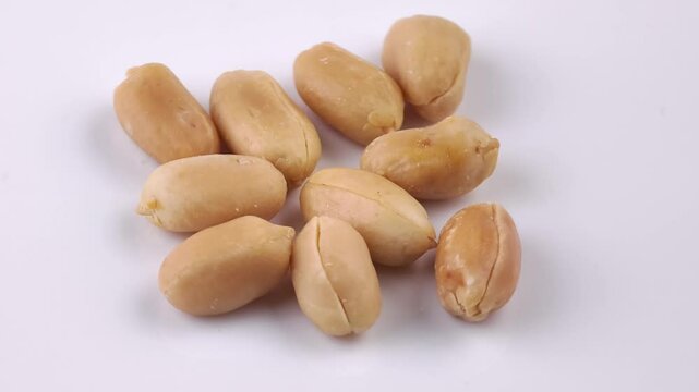 Roasted peanuts on white background